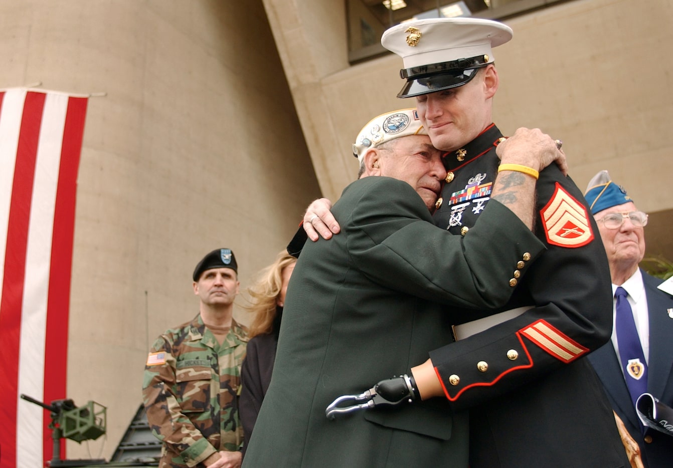 Pearl Harbor survivor Houston James of Dallas was overcome with emotion as he embraced...