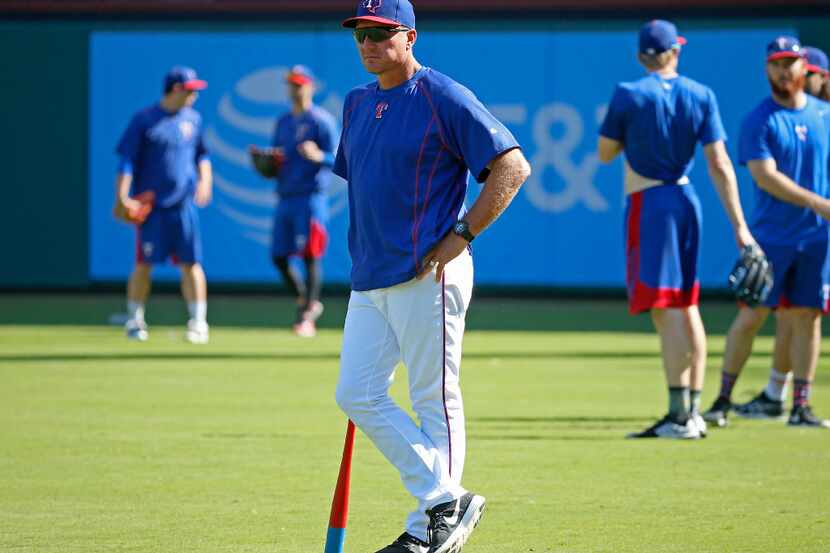 Texas Rangers manager Jeff Banister watches his players during the team workout at Globe...