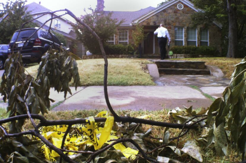 A Dallas police homicide detective stood Wednesday outside the home where Yayehyirad Lemma...