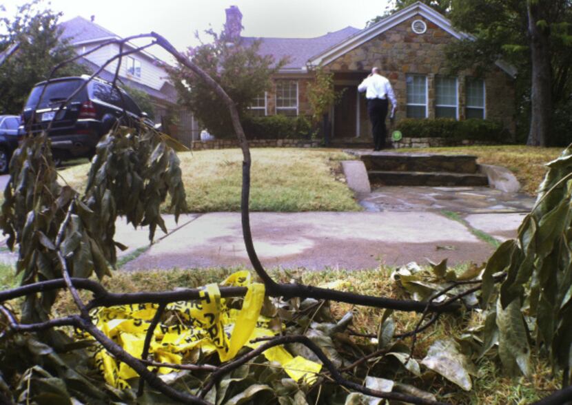 A Dallas police homicide detective stood Wednesday outside the home where Yayehyirad Lemma...