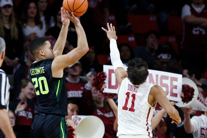 Baylor guard Manu Lecomte (20) shoots over Oklahoma guard Trae Young (11) during the second...