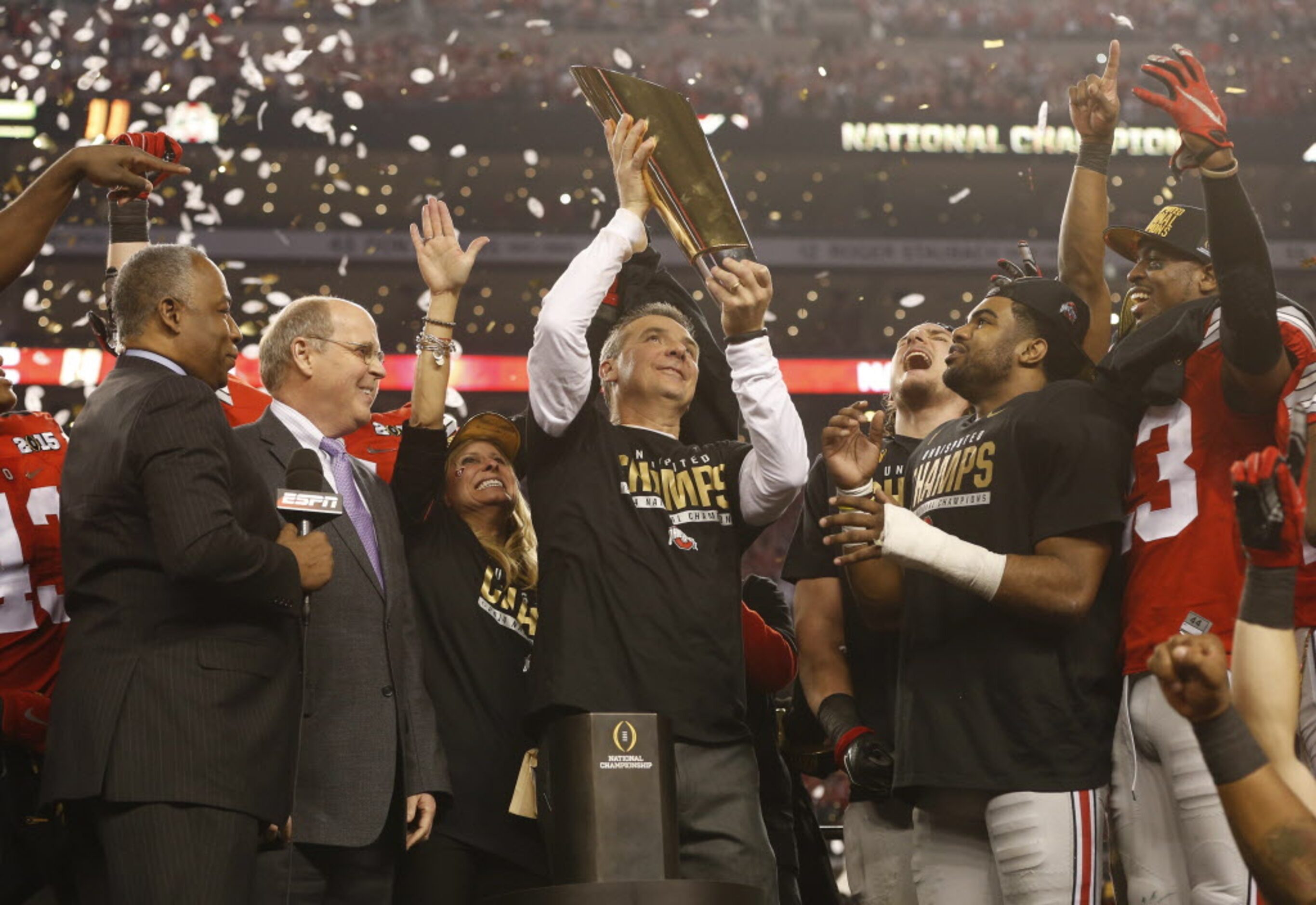 Ohio State Buckeyes head coach Urban Meyer hold the championship trophy as Ohio State...