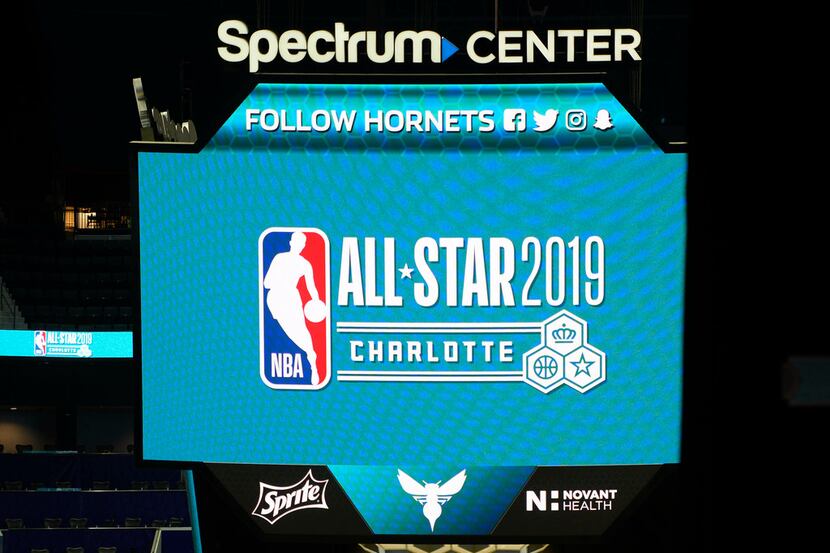 The scoreboard above the floor at the Spectrum Center displays the logo for the upcoming NBA...