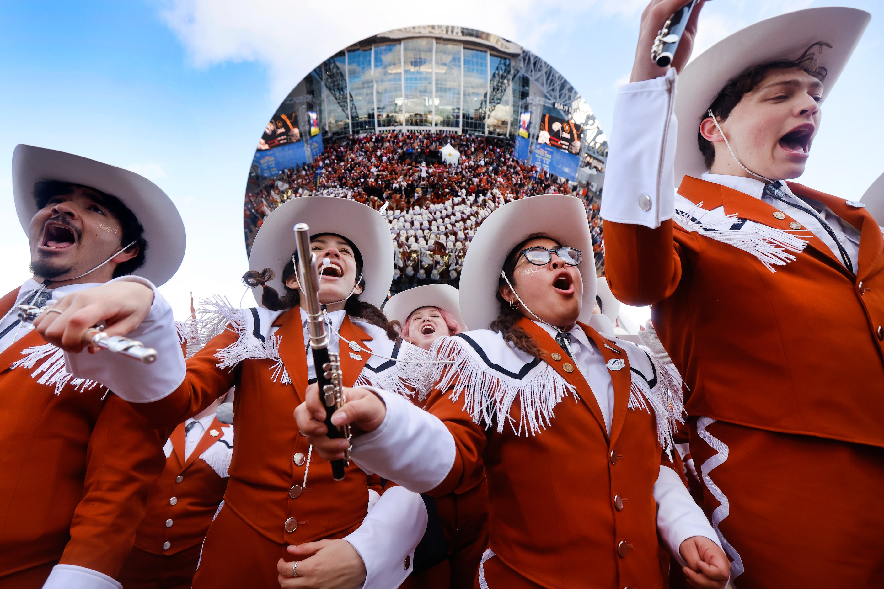 The University of Texas Longhorn Band members dance as they perform during a prep rally...