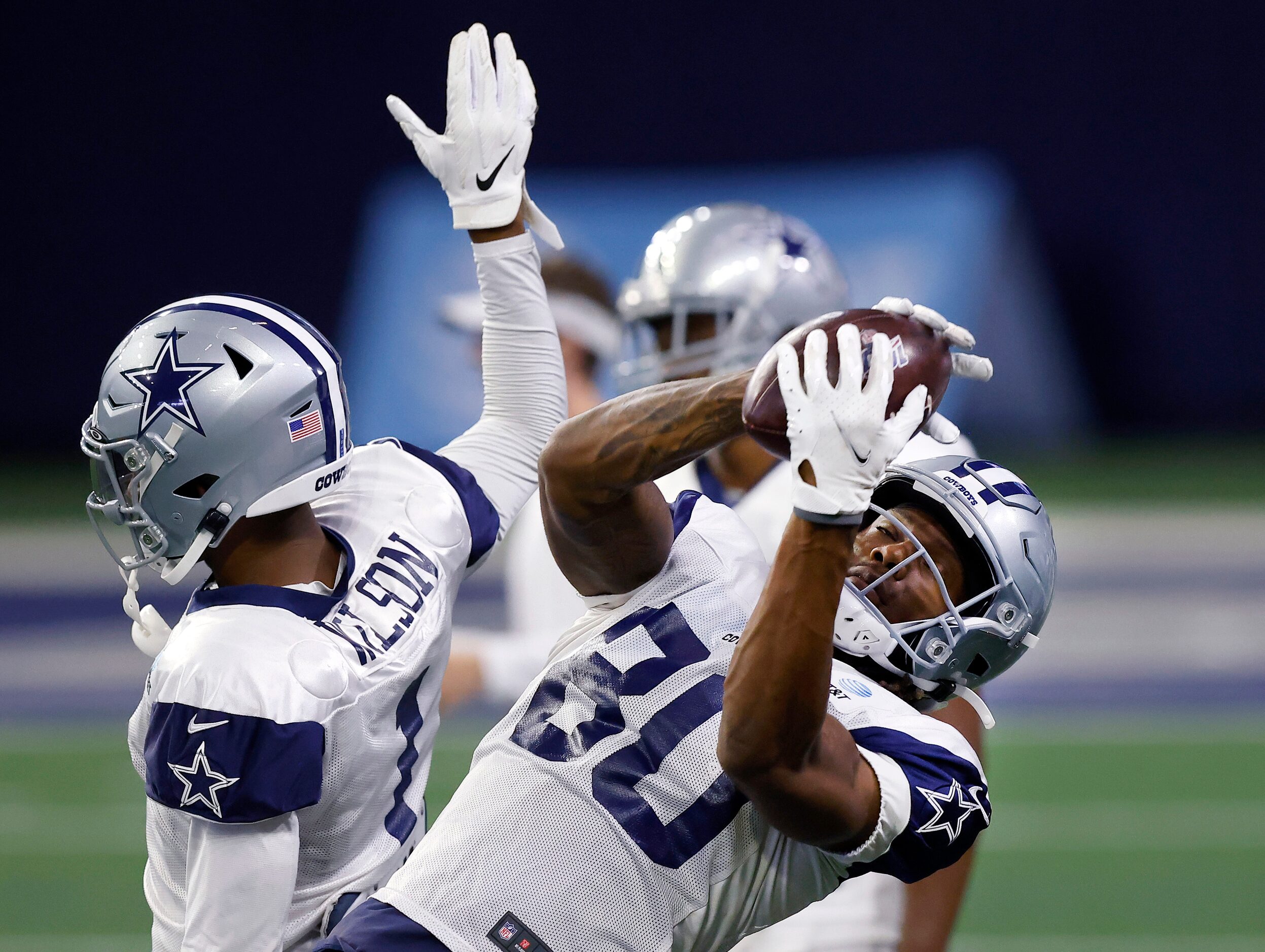 Dallas Cowboys wide receiver Brandon Smith (80) catches a pass over the outstretched hand of...