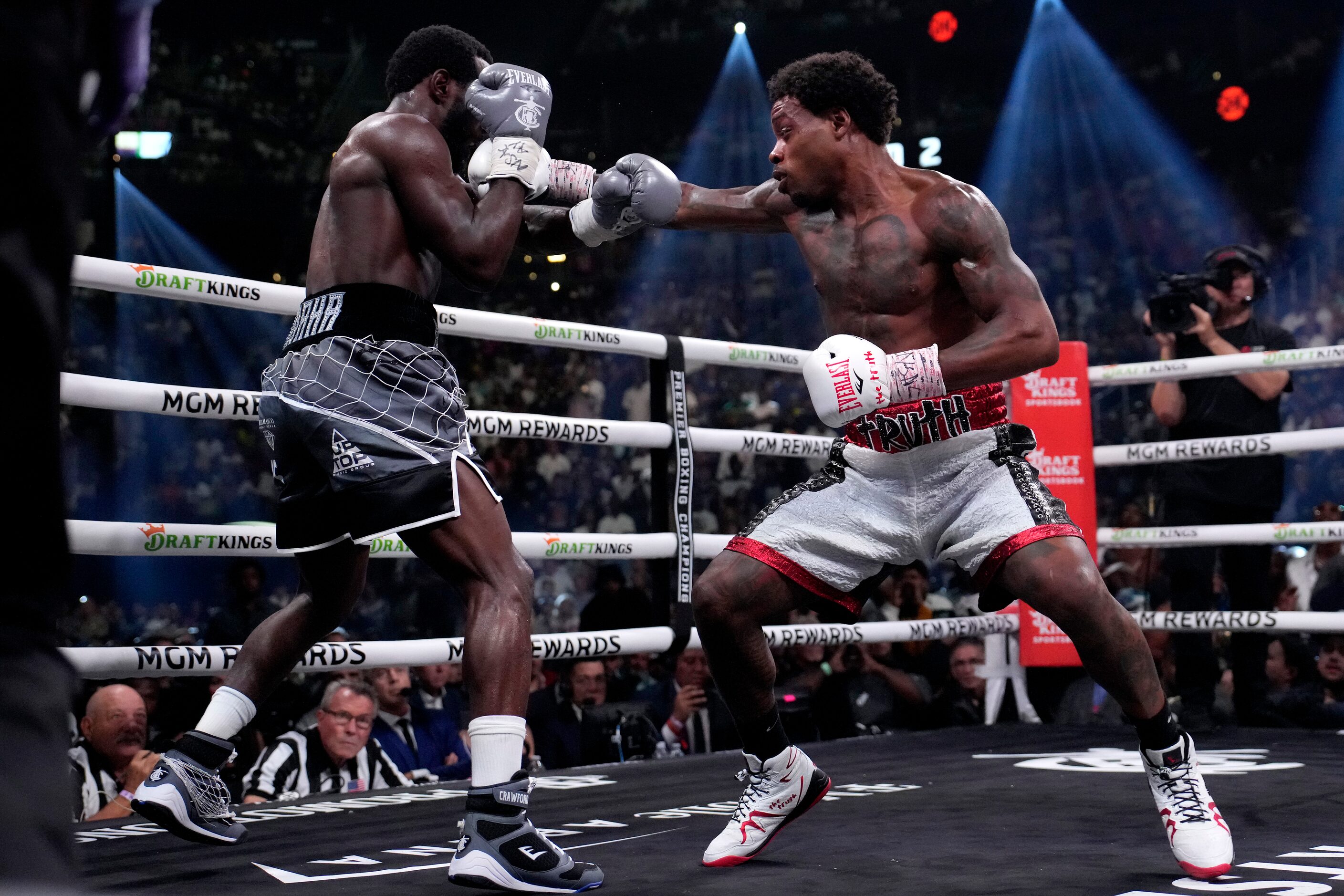 Errol Spence Jr., right, and Terence Crawford fight during their undisputed welterweight...