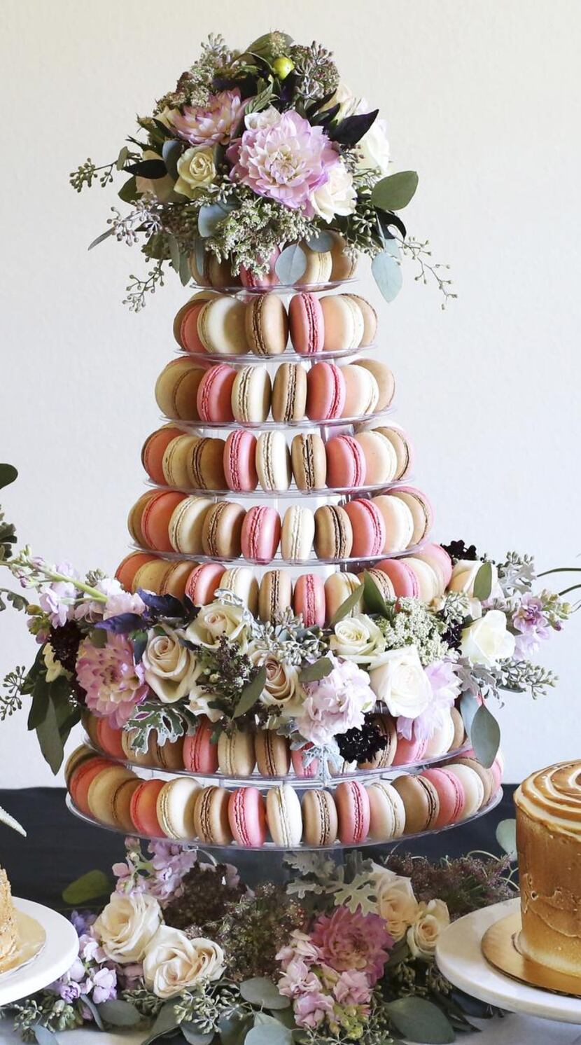 Bisous Bisous Pâtisserie’s  macaron tower for May has rose and cherry blossom flavors that...