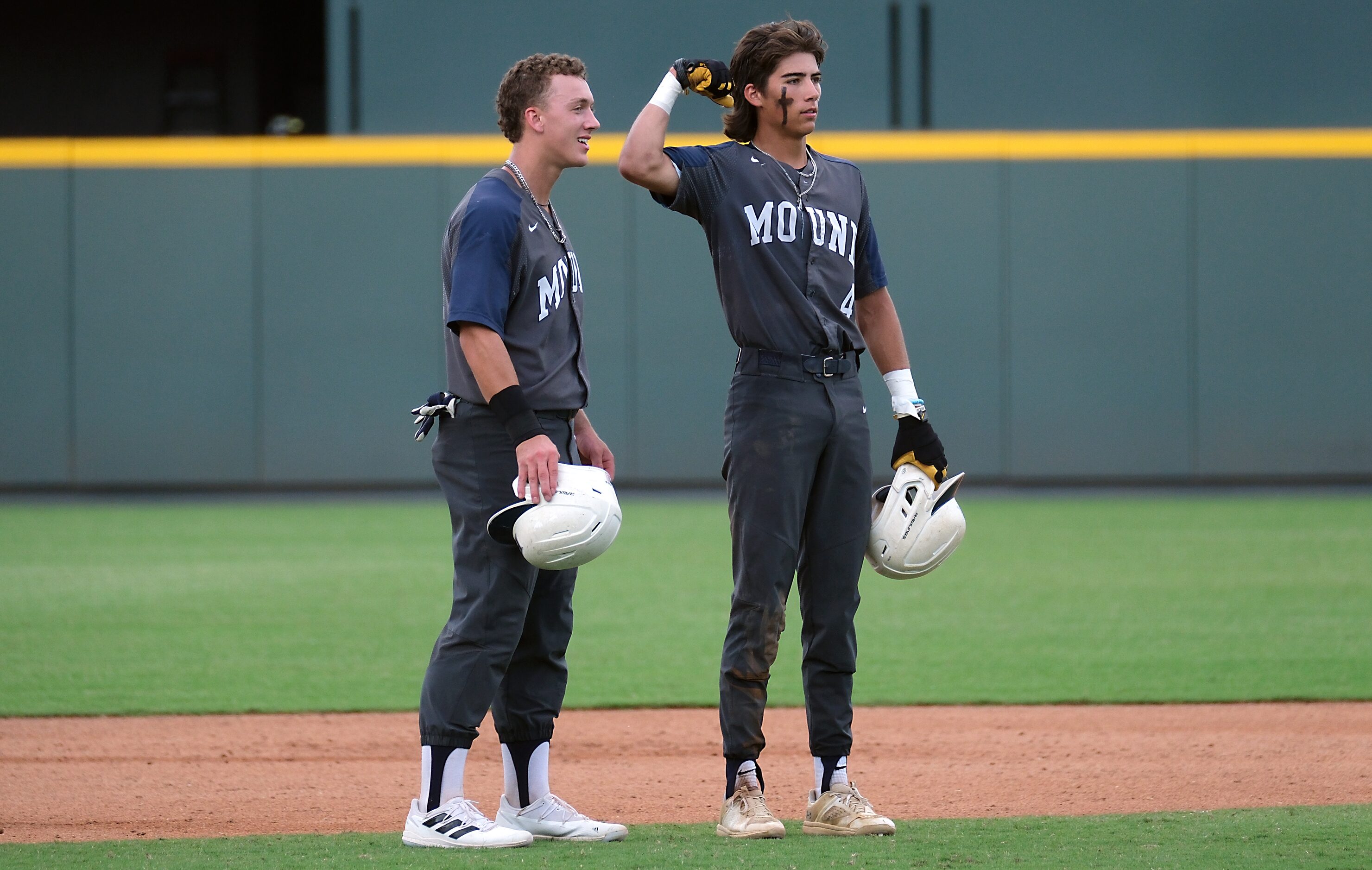 Flower Mound Ryder McDaniel, (4), flexes his muscles as Sam Erickson, (21), looks on during...