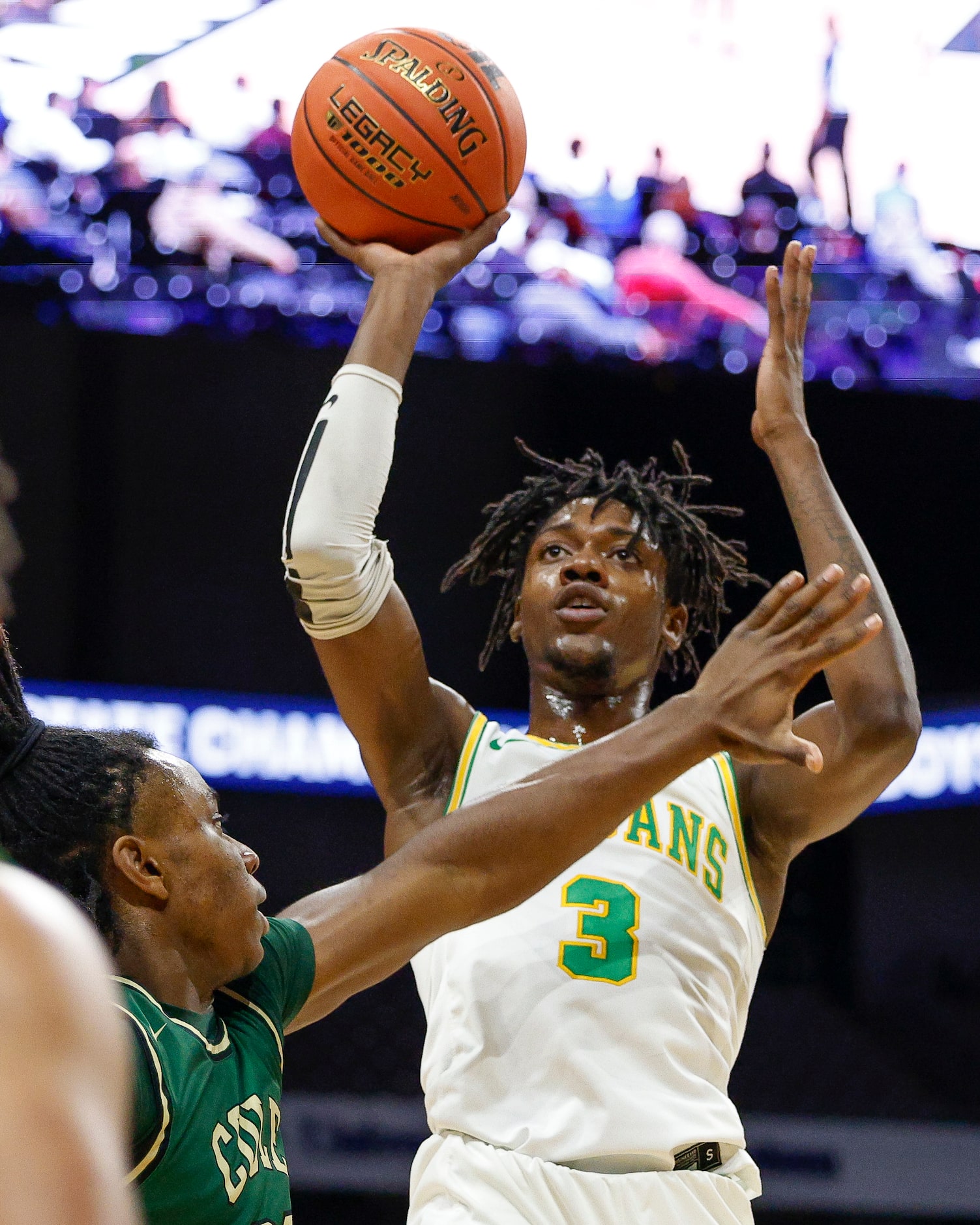 Madison forward Leonard Miles IV (3) attempts a shot over a defending San Antonio Cole...