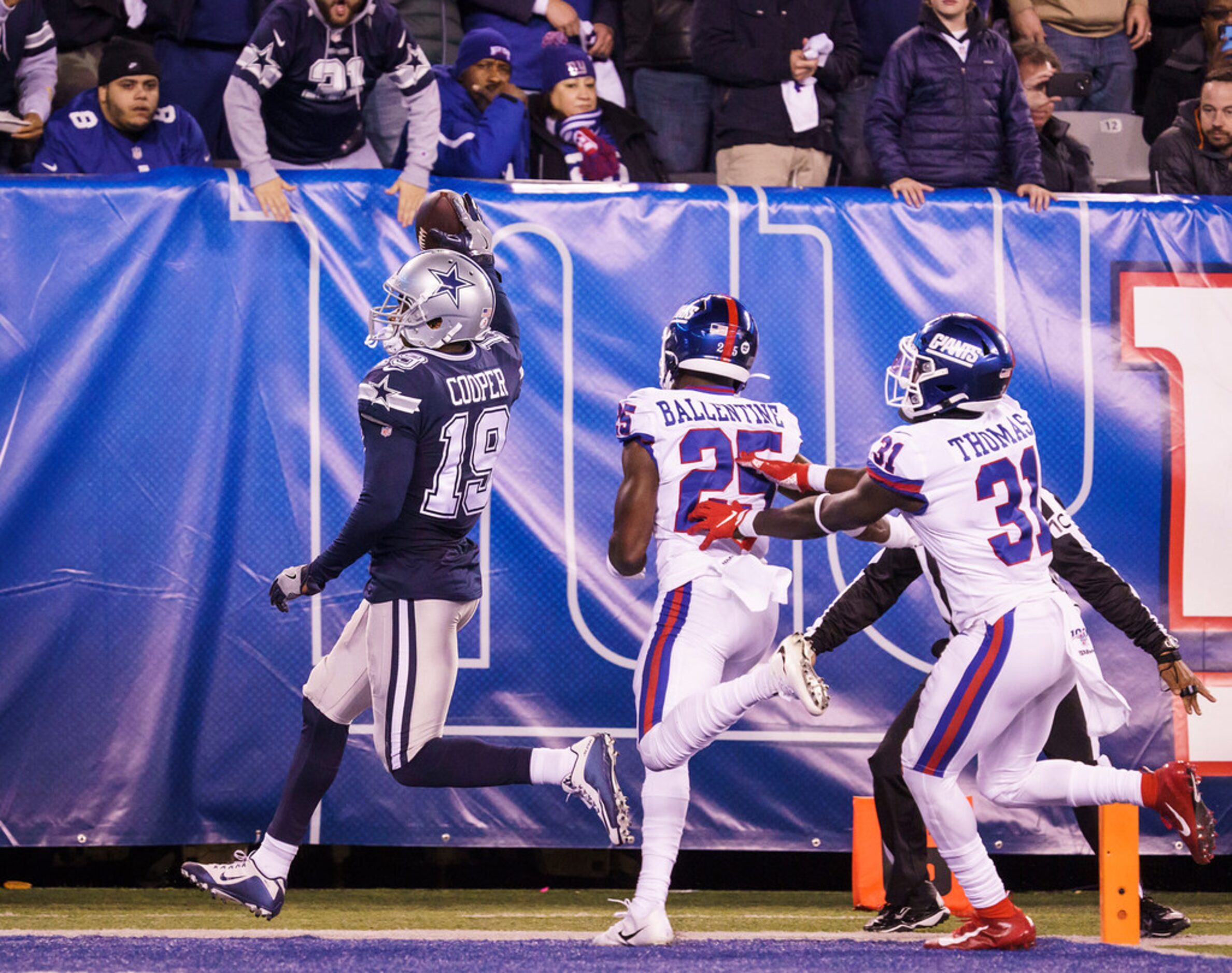 Dallas Cowboys wide receiver Amari Cooper (19) scores on a 45-yard touchdown past New York...