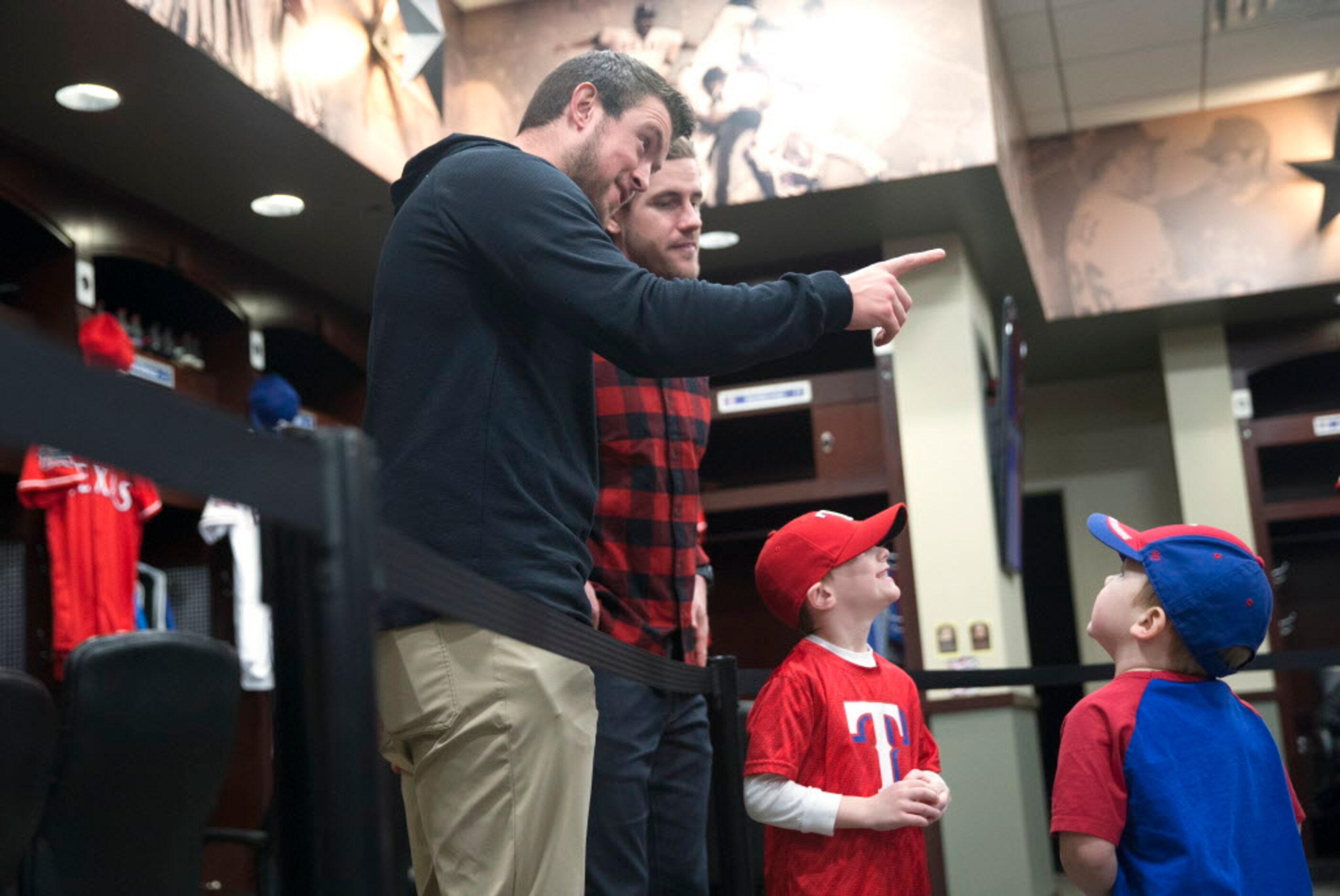 Inside the Texas Rangers clubhouse, Texas Rangers Jeffrey Springs, left, and Patrick Wisdom...