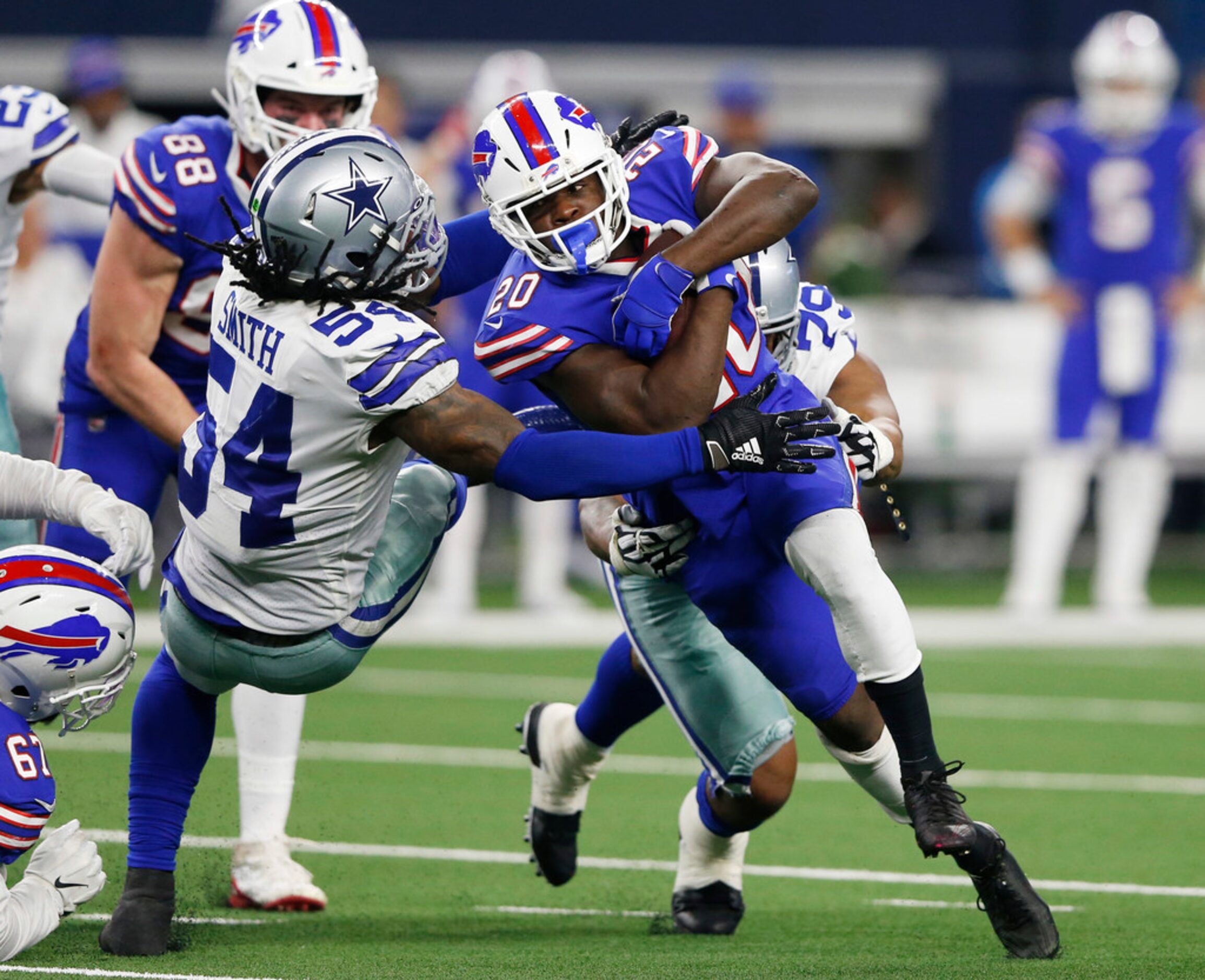 Dallas Cowboys middle linebacker Jaylon Smith (54) and Dallas Cowboys defensive end Michael...