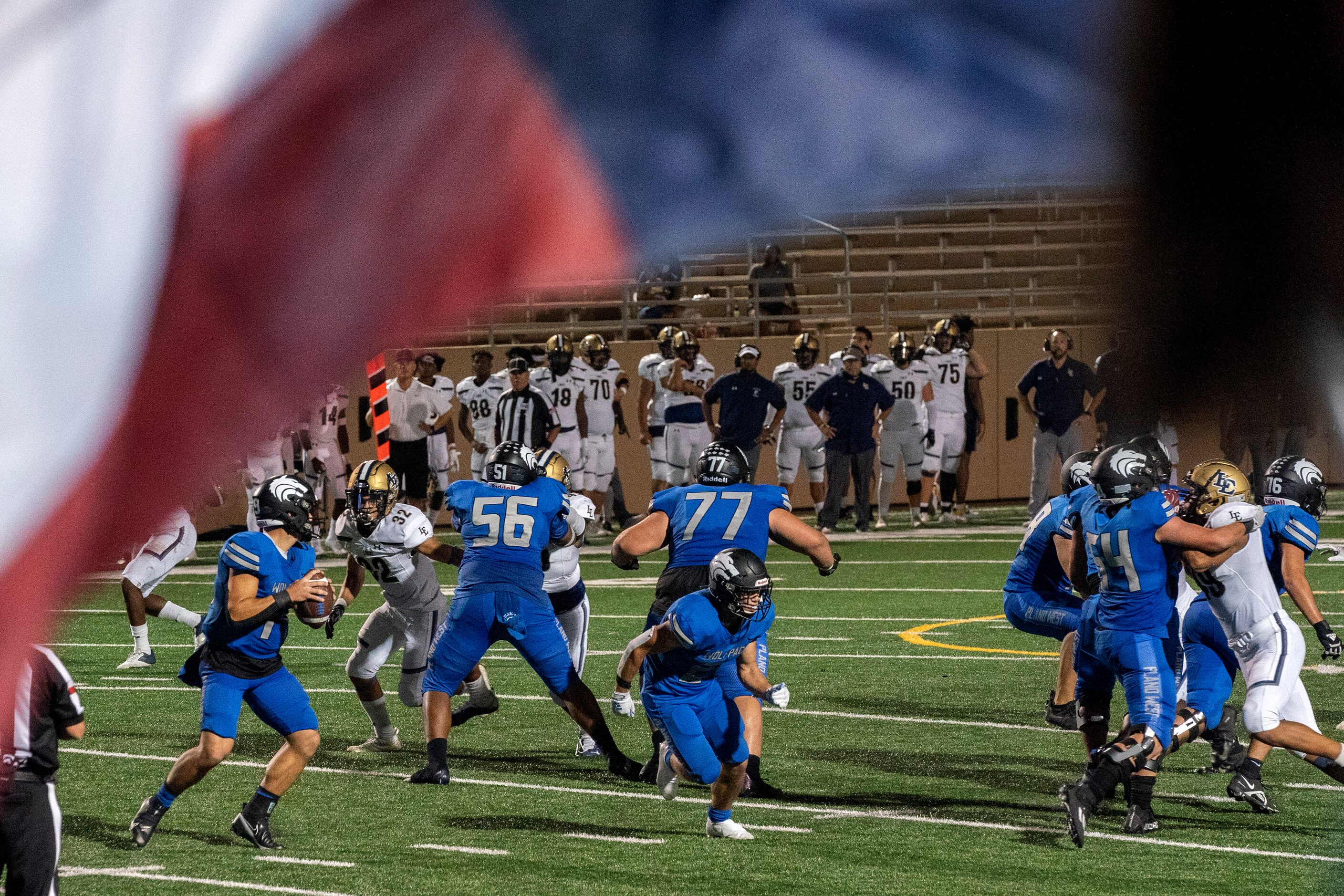 Plano West junior quarterback Vance Feuerbacher (19) drops back to pass against Little Elm...