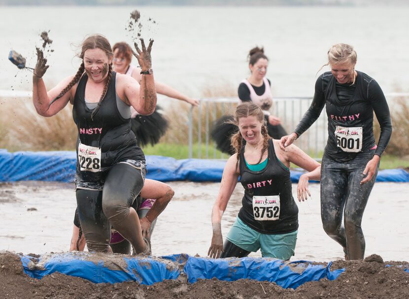 Women competing in the Dirty Girl Mud Run at Cedar Hill State Park on Saturday, Oct. 6,...