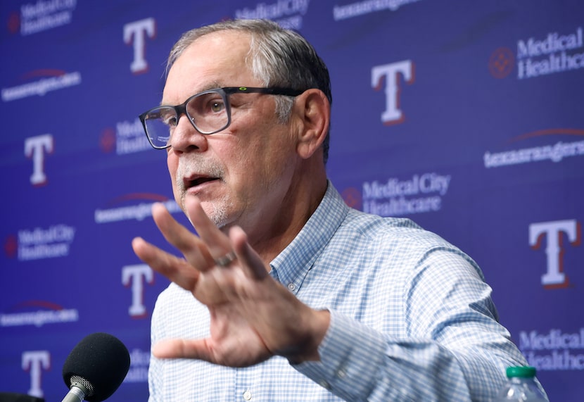 Texas Rangers manager Bruce Bochy responds to a question from reporters during a post season...