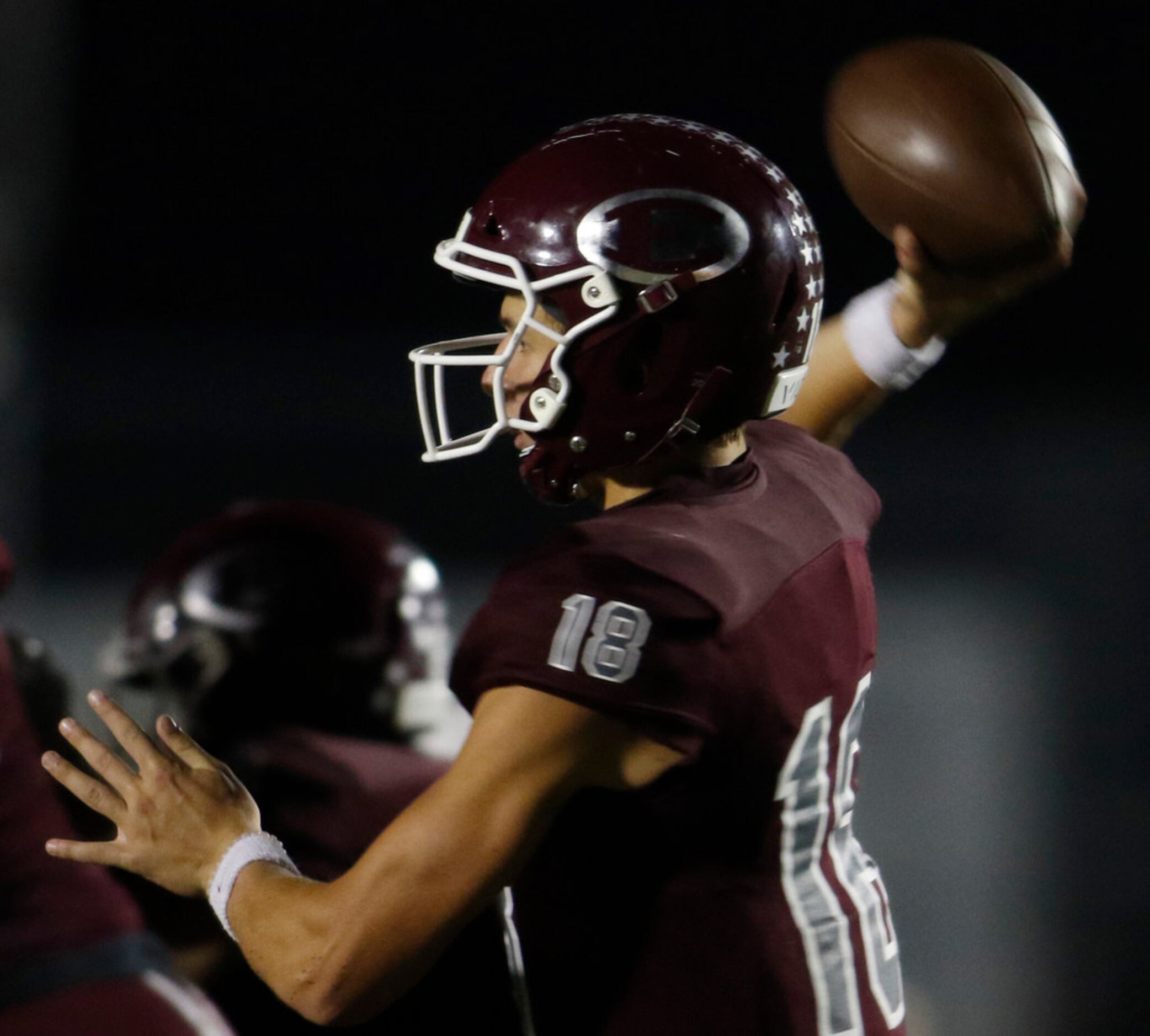 Ennis Lions quarterback Collin Drake (18) releases a pass during first half action against...