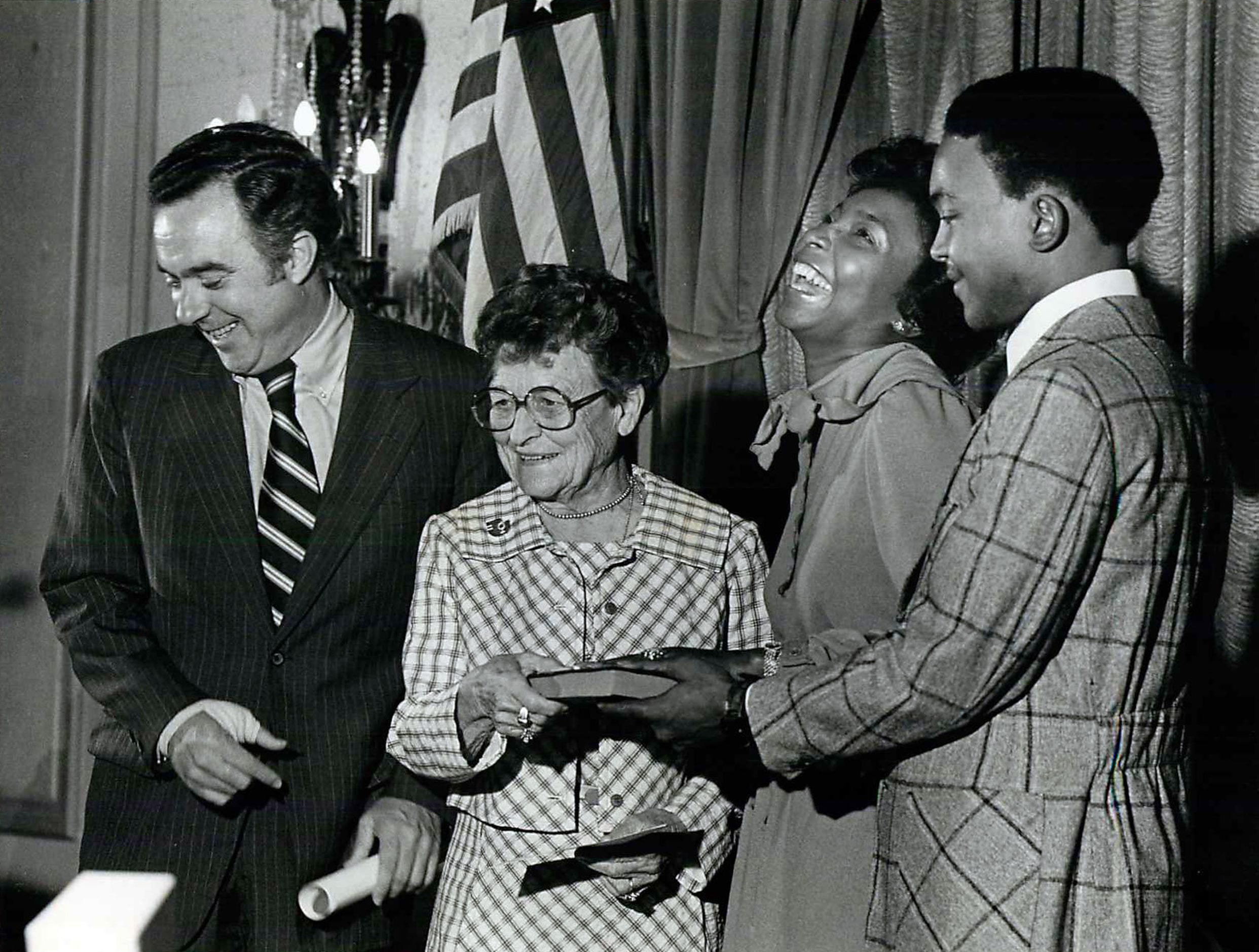 Published October 1, 1977 - HEW Secretary Joseph Califano (left) shares a laugh with U. S....