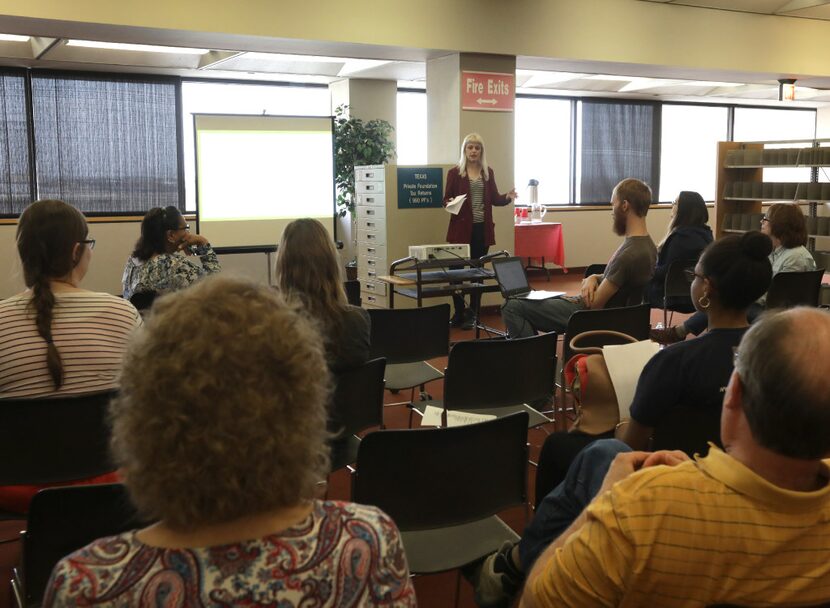 Catherine Gilman talks to guests about the new seed library program at the Dallas Public...