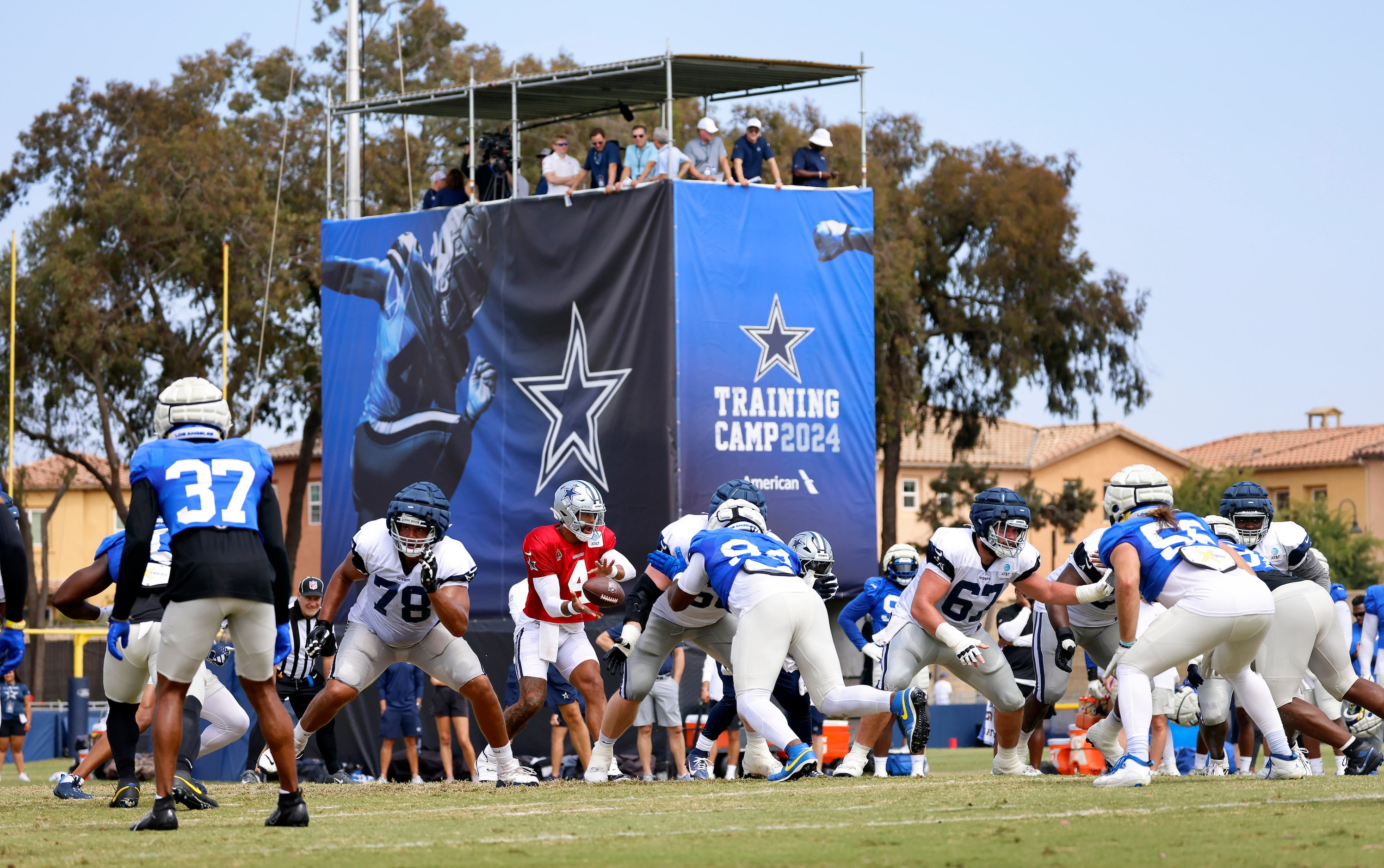 Dallas Cowboys quarterback Dak Prescott (4) takes a snap as they run a red zone play against...