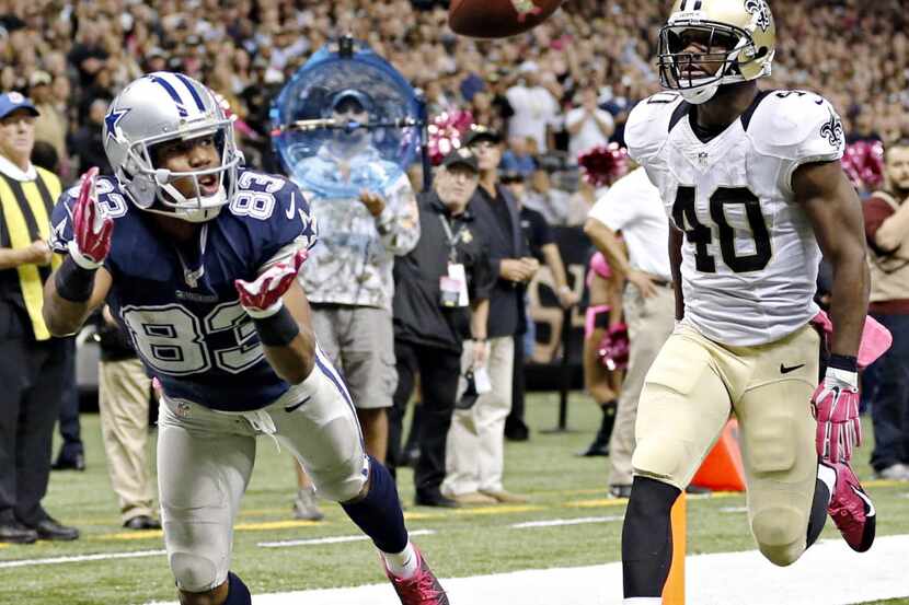 Dallas Cowboys wide receiver Terrance Williams (83) stays ahead of New Orleans Saints...