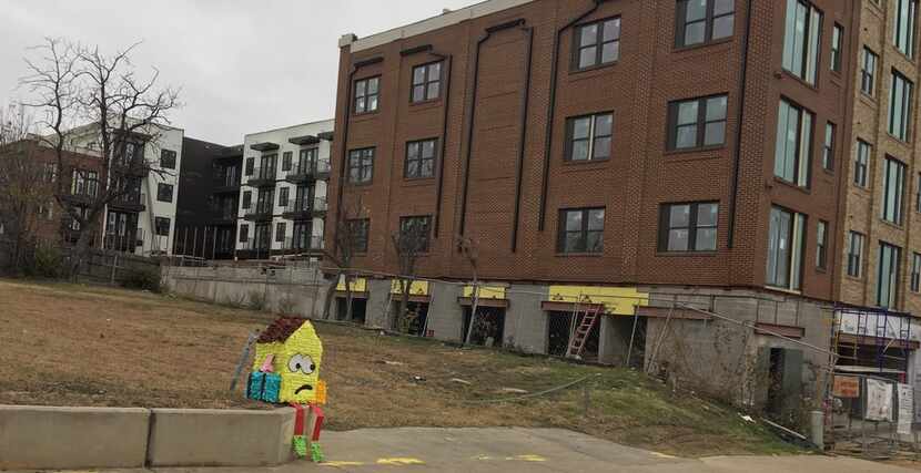 Dallas artist Giovanni Valderas left his sad-house piñatas on street corners to call...