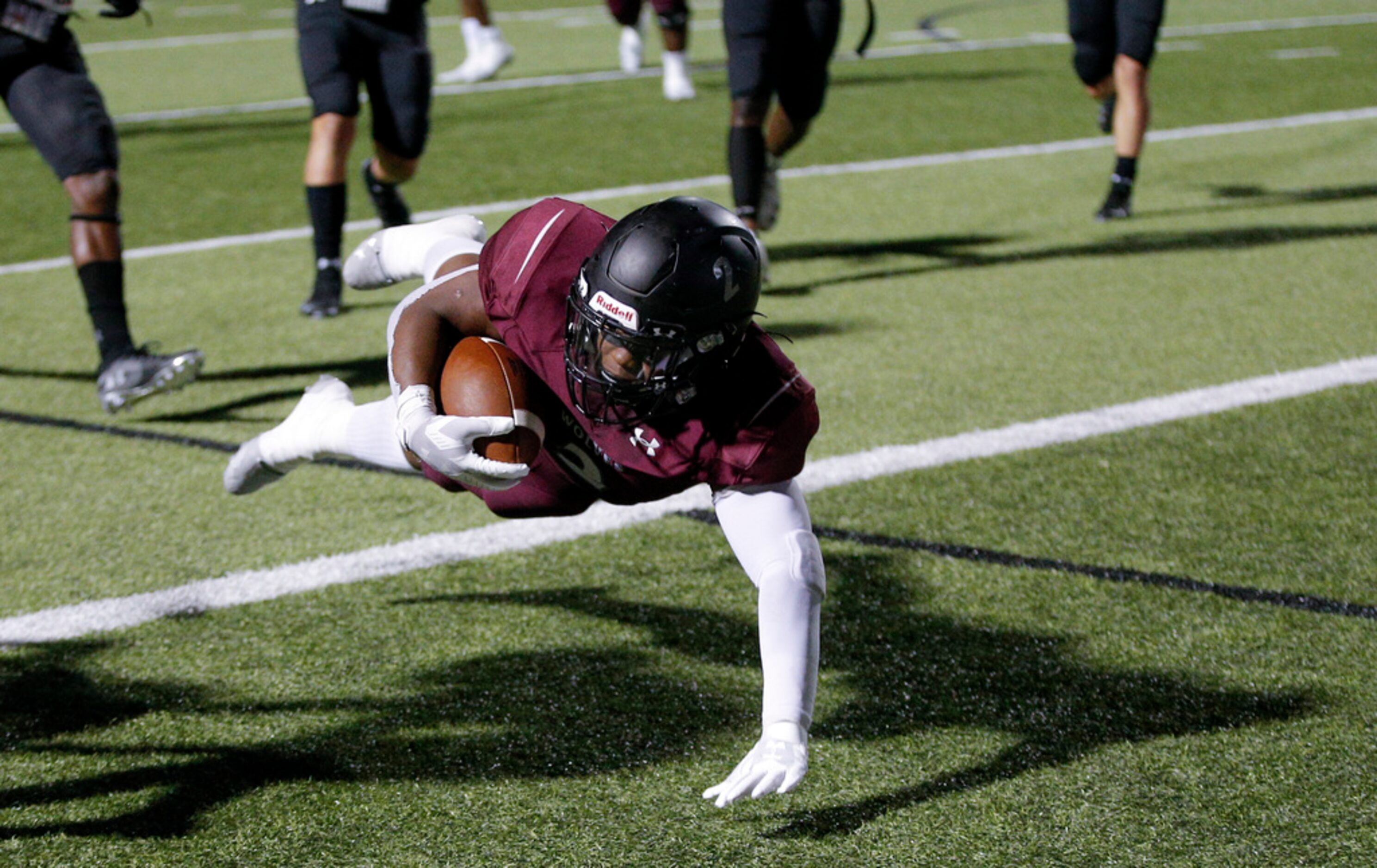 TXHSFB Mansfield Timberview junior running back Deuce Jones (2) scores a touchdown during...