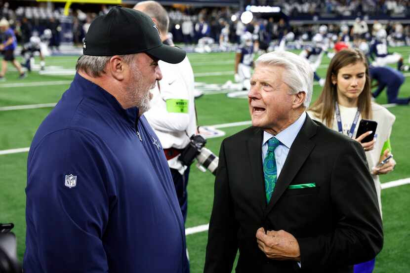 Dallas Cowboys head coach Mike McCarthy (left) speaks with former Cowboys head coach Jimmy...