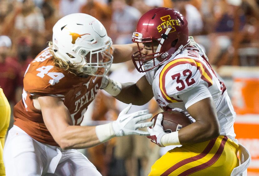 Texas' Breckyn Hager (44) tries to bring down Iowa State running back David Montgomery (32)...