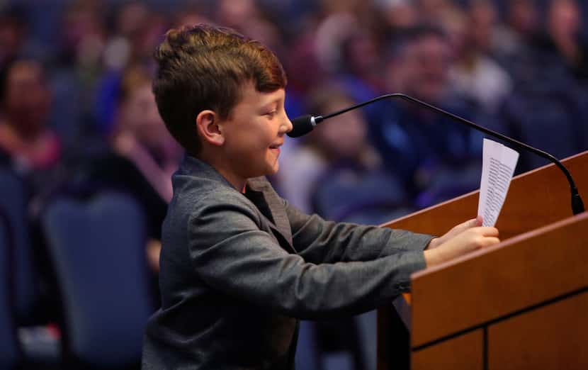 Nine-year-old Kain Hendrix is unable to hide a smile as he addresses school trustees as he...