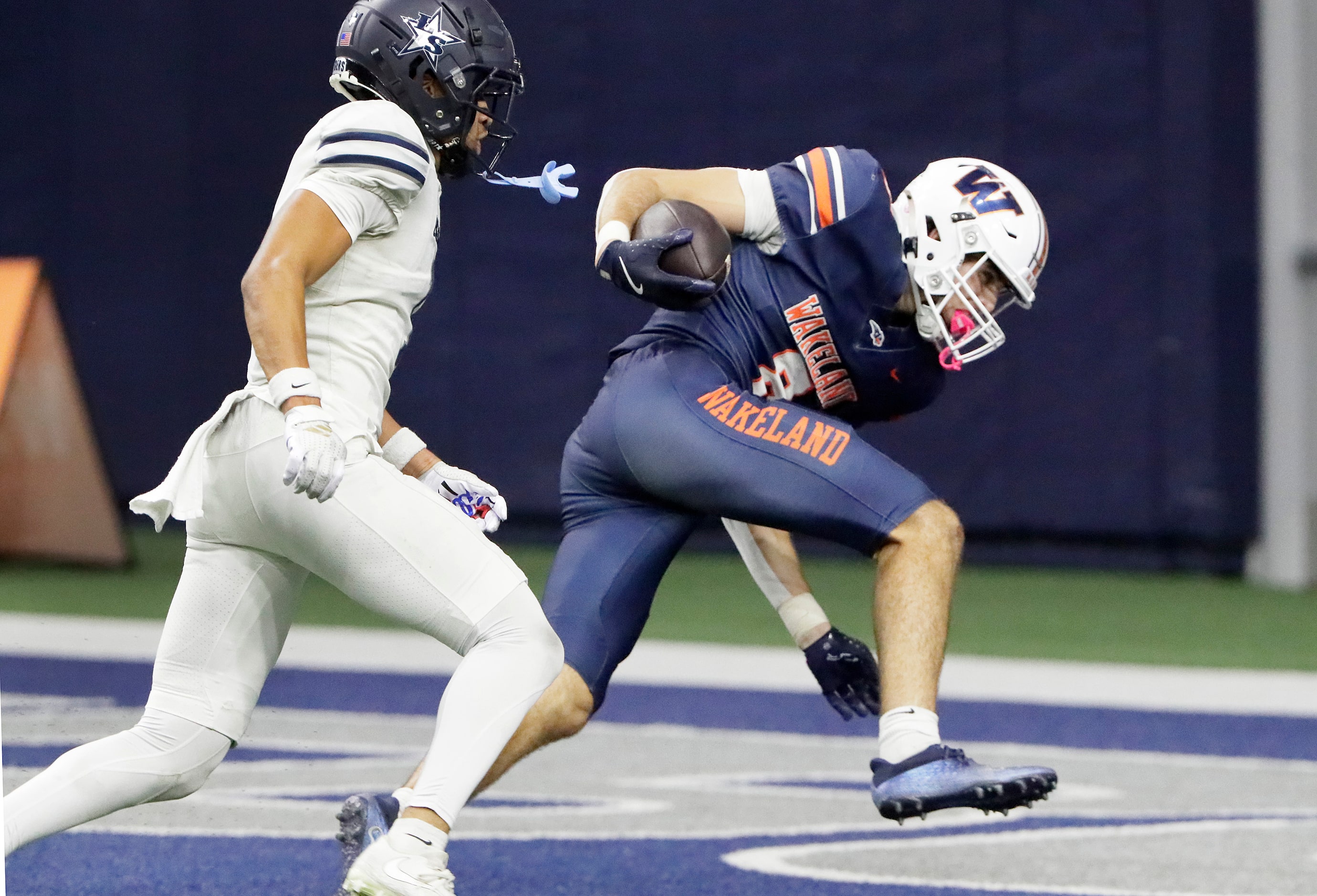 Wakeland High School wide receiver Ryder Treadway (8) comes down in the end zone with the...