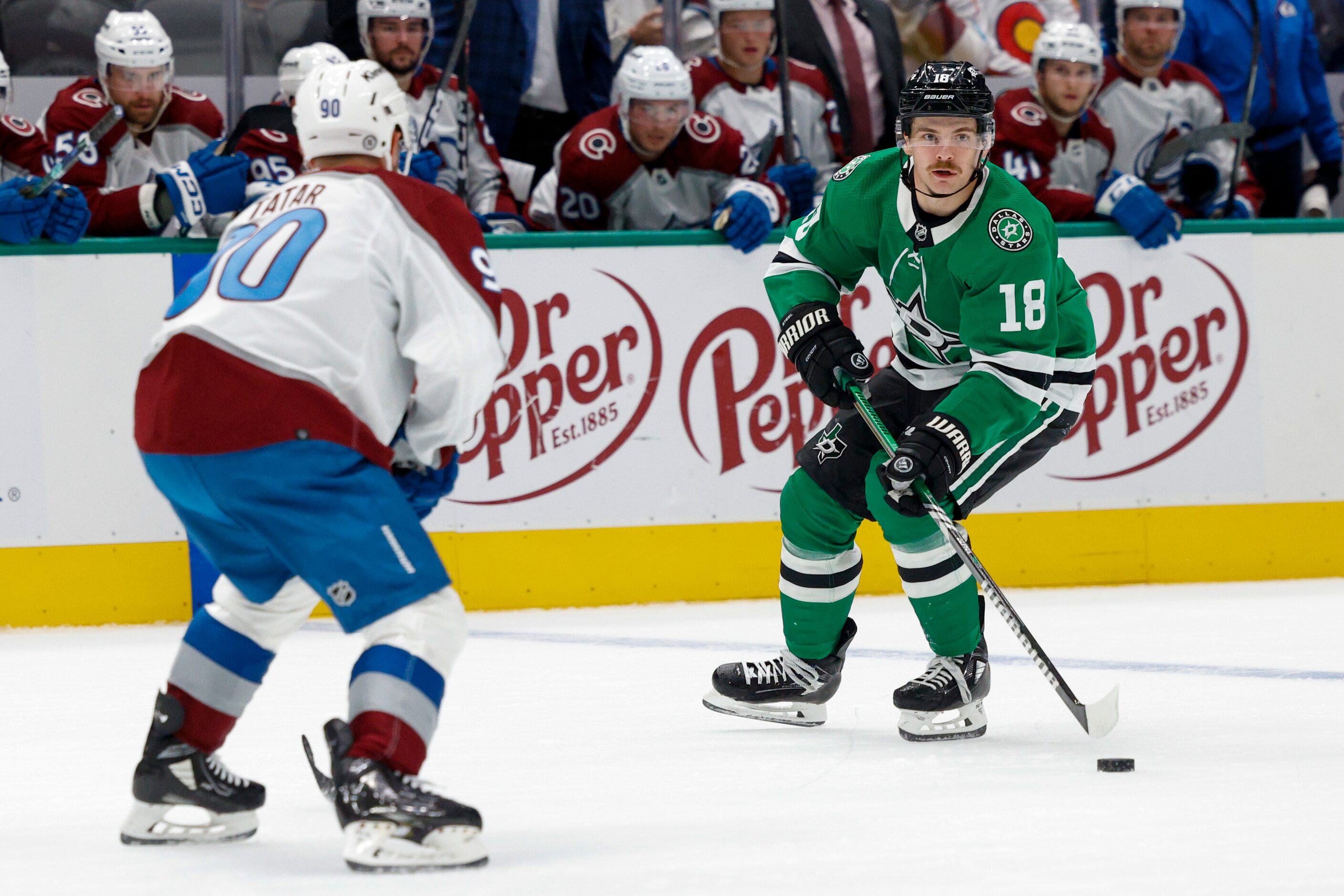 Dallas Stars center Sam Steel (18) looks to pass ahead of Colorado Avalanche left wing Tomas...