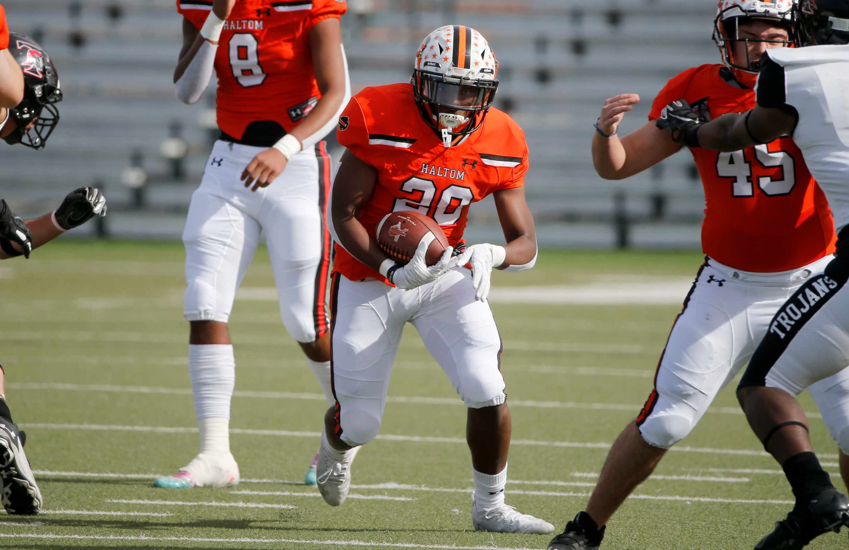 Haltom running back A.J. Reynolds runs the ball against Euless Trinity during their District...