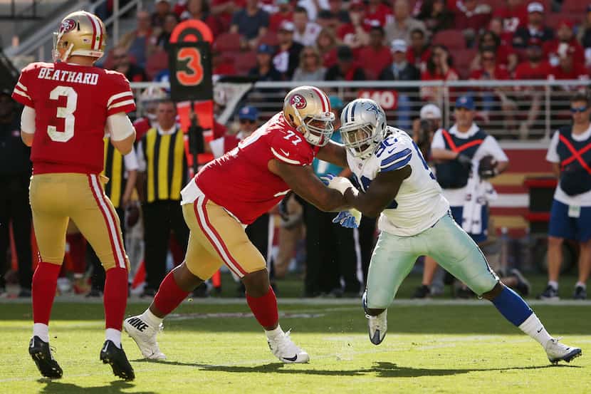 San Francisco 49ers offensive tackle Trent Brown (77) attempts to prevent Dallas Cowboys...