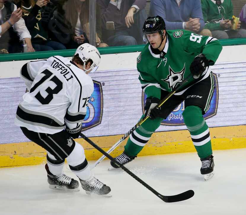 Dallas Stars center Jason Spezza (90) and Los Angeles Kings right wing Tyler Toffoli (73)...