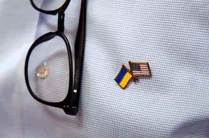 Ukraine-born artist Vladimir Grygorenko wears a lapel pin bearing the U.S, and Ukrainian...