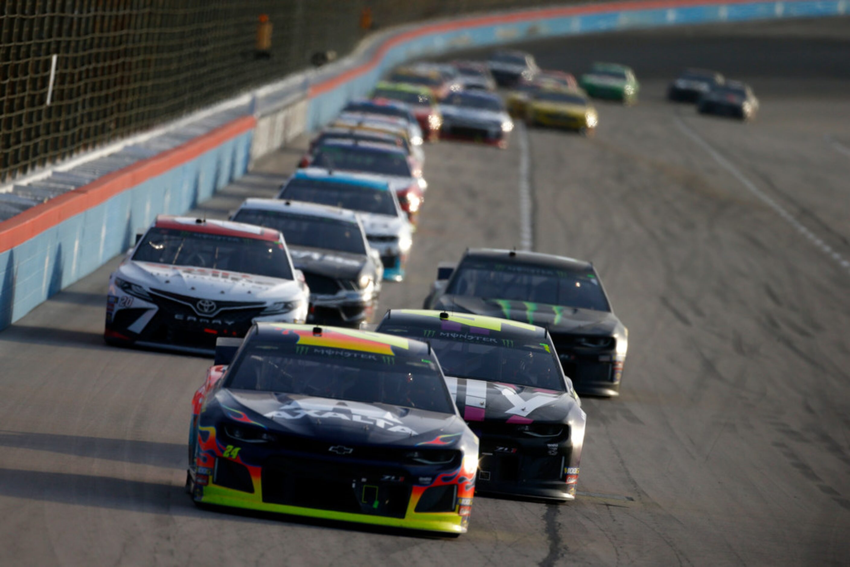 FORT WORTH, TEXAS - NOVEMBER 03: William Byron, driver of the #24 Axalta Chevrolet, leads a...