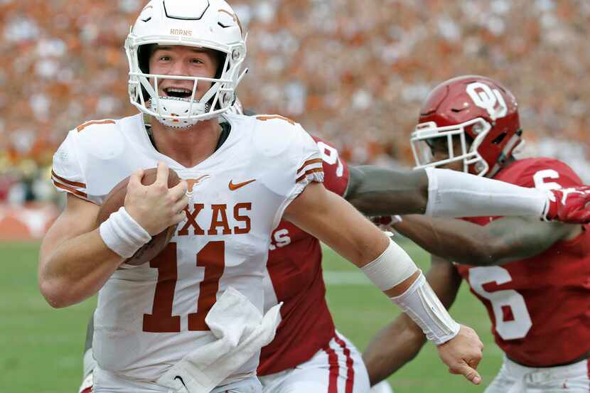 Texas Longhorns quarterback Sam Ehlinger (11) is all smiles as he scores a second-quarter...