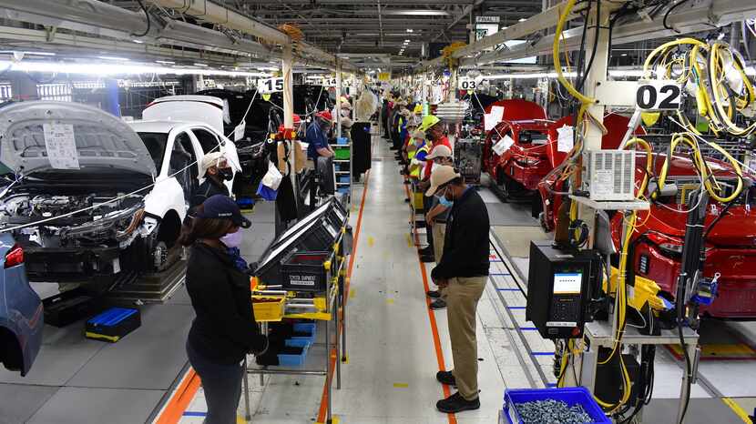 In Toyota factories around North America, production line workers paused for 8 minutes and...