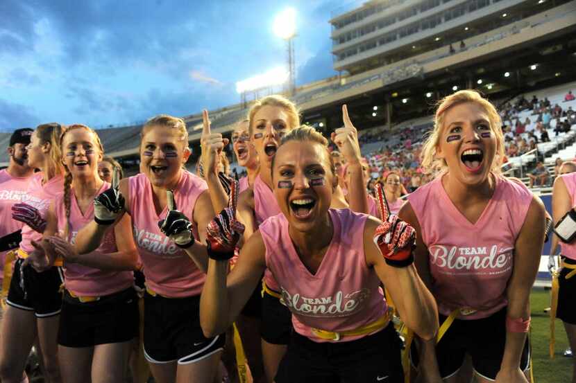 Blondes cheer at Blondes vs. Brunettes powder puff game at Cotton Bowl in Dallas, TX on...