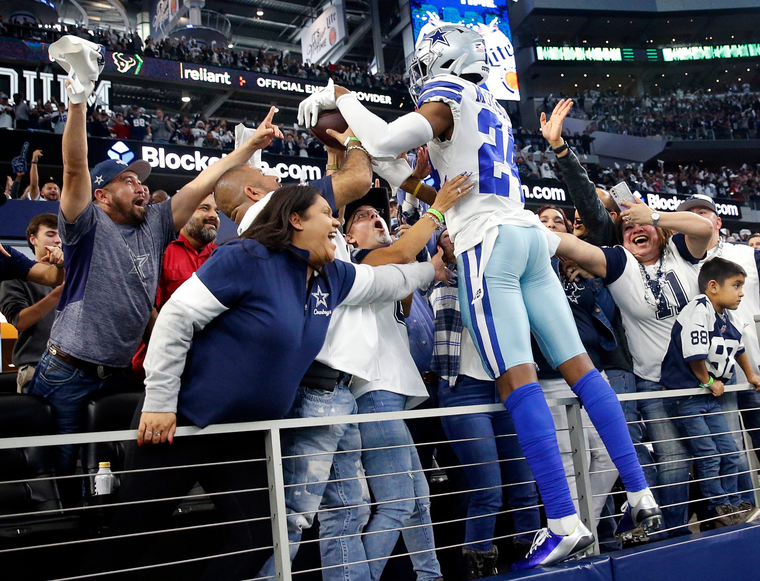 Dallas Cowboys safety Israel Mukuamu (24) crawls up in the suites to celebrate their win...