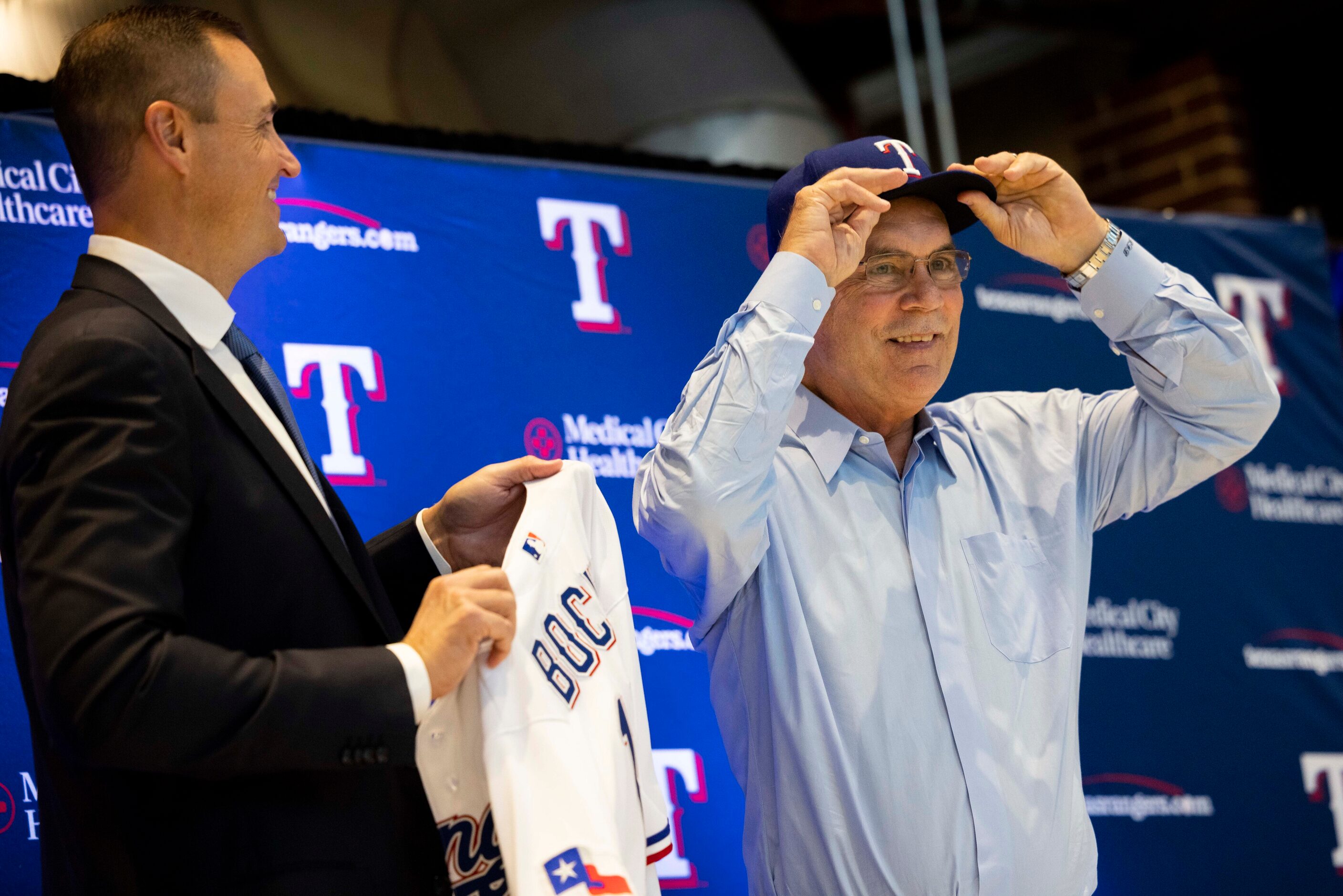 Chris Young (left), the team's executive vice president and general manager, watches as new...