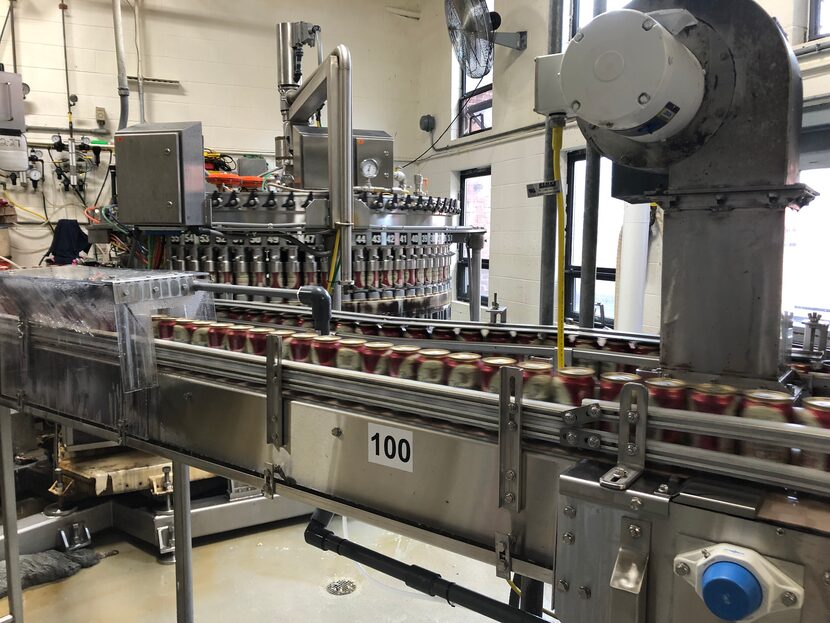 An up-close view of the canning line in action is a highlight of the brewery tour. (Leslie...