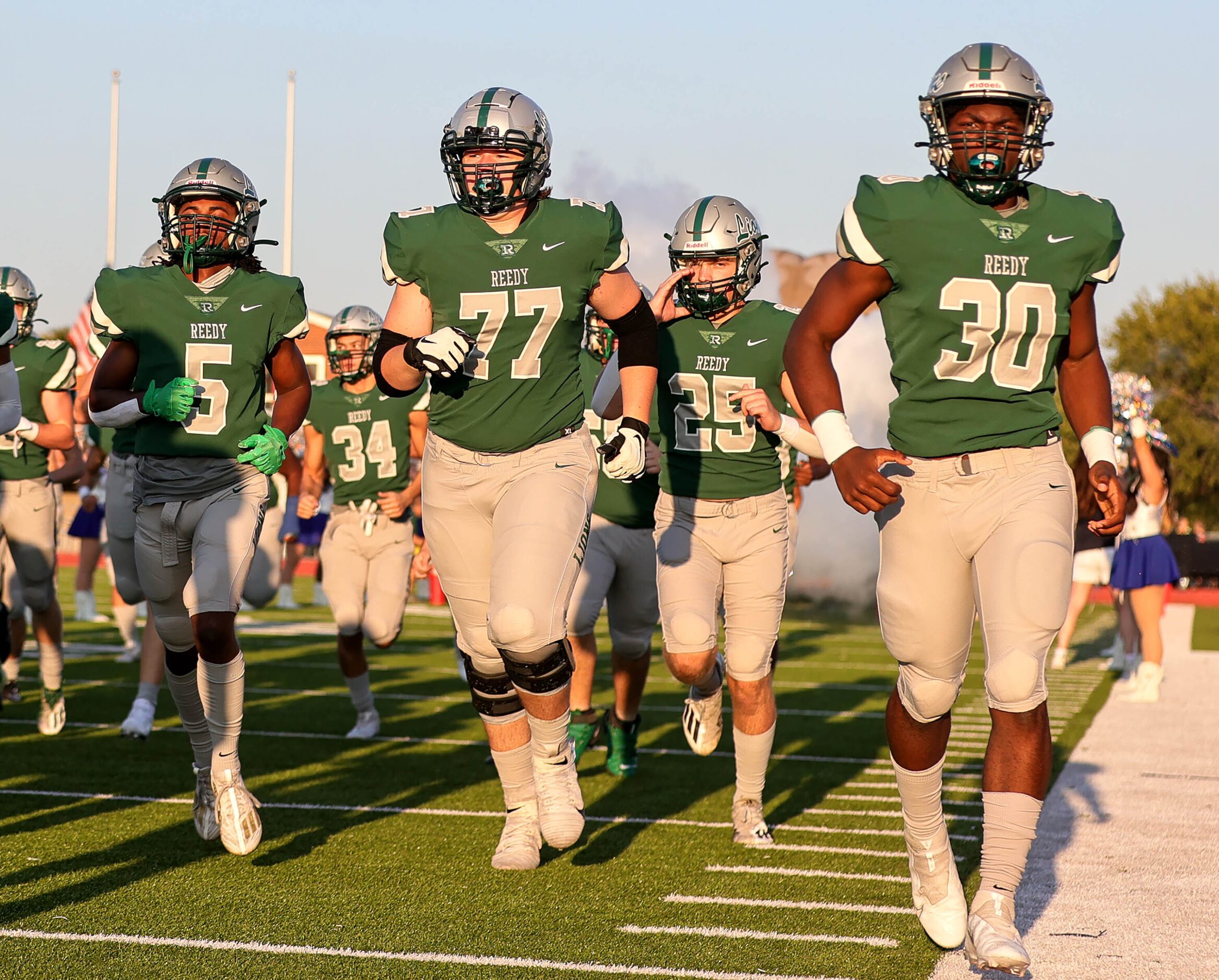 The Frisco Reedy Lions enter the field to face Frisco Lone Star in a high school football...