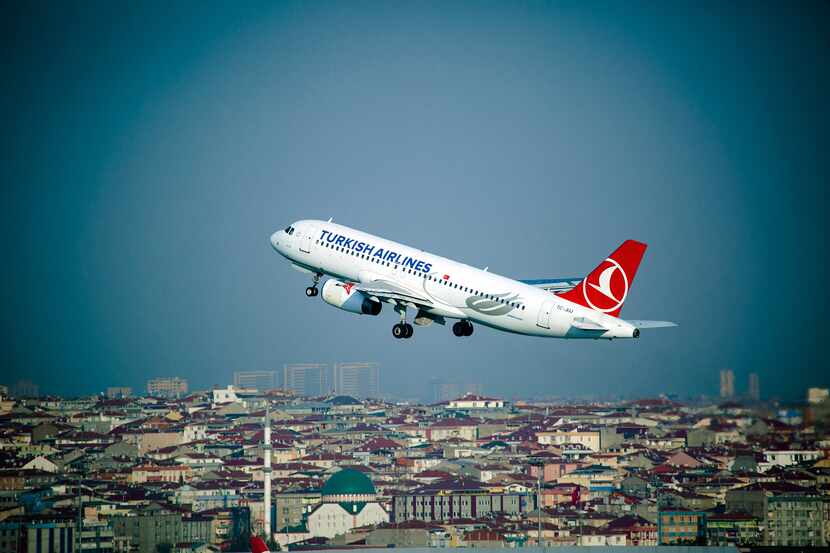 A Turkish Airlines Airbus A320 jet takes off from Istanbul Airport in Turkey. Turkey's flag...