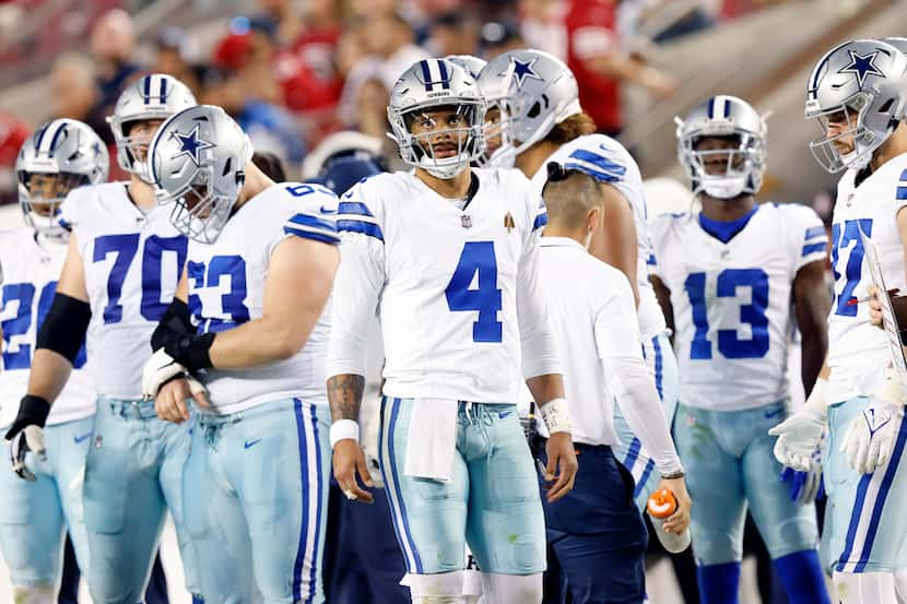 Dallas Cowboys quarterback Dak Prescott (4) paces the sideline after throwing a second half...