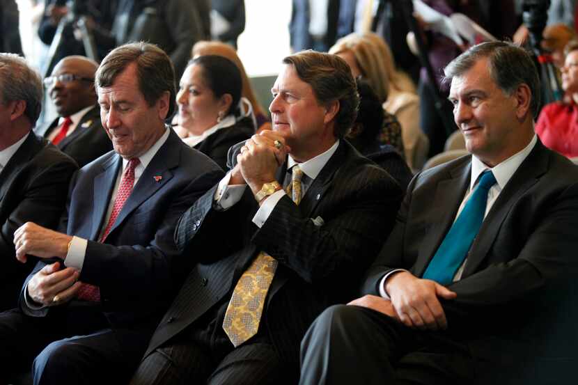 SMU President R. Gerald Turner (from left), AT&T Senior Executive Vice President Ron Spears,...