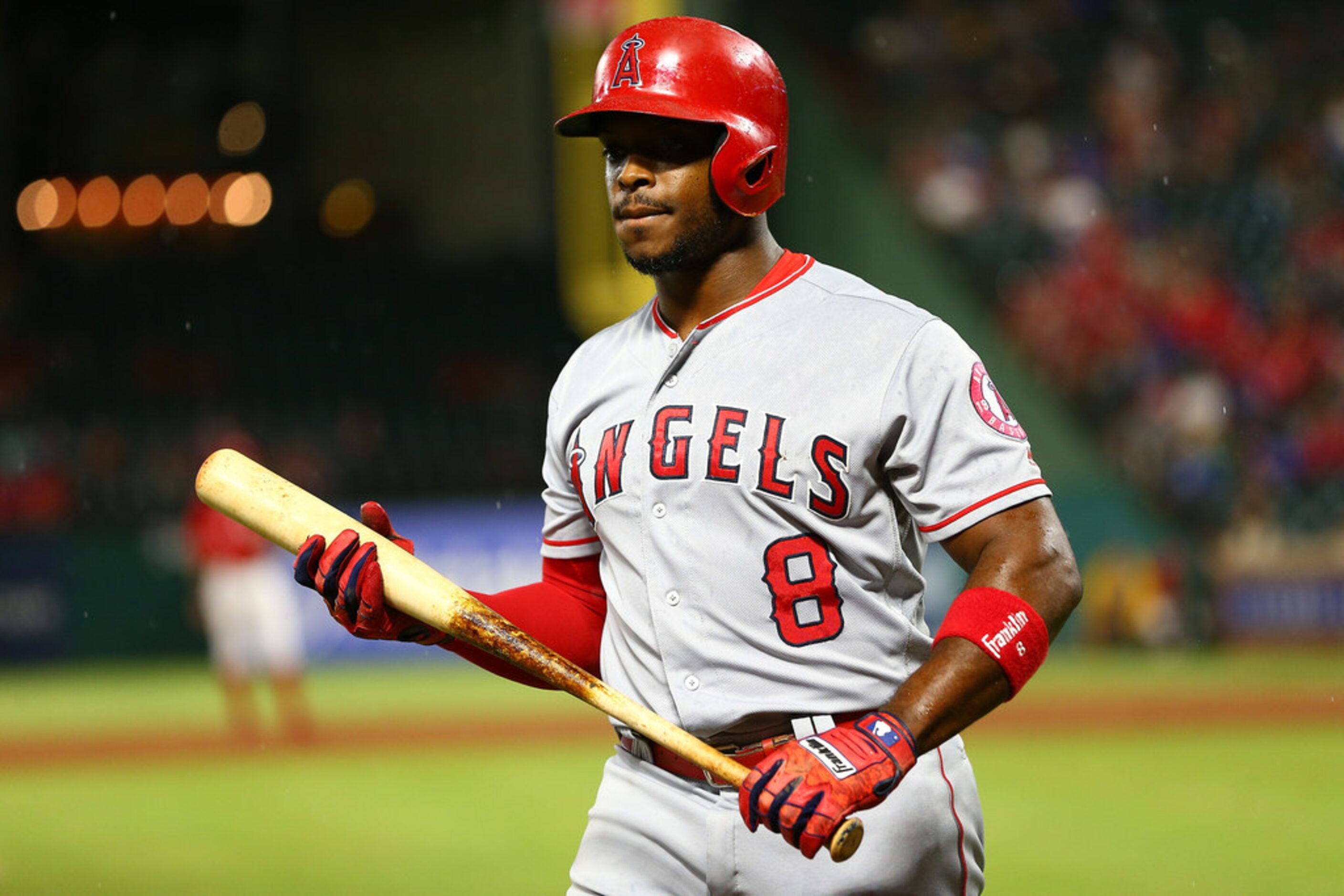 ARLINGTON, TX - AUGUST 18: Justin Upton #8 of the Los Angeles Angels of Anaheim reacts after...