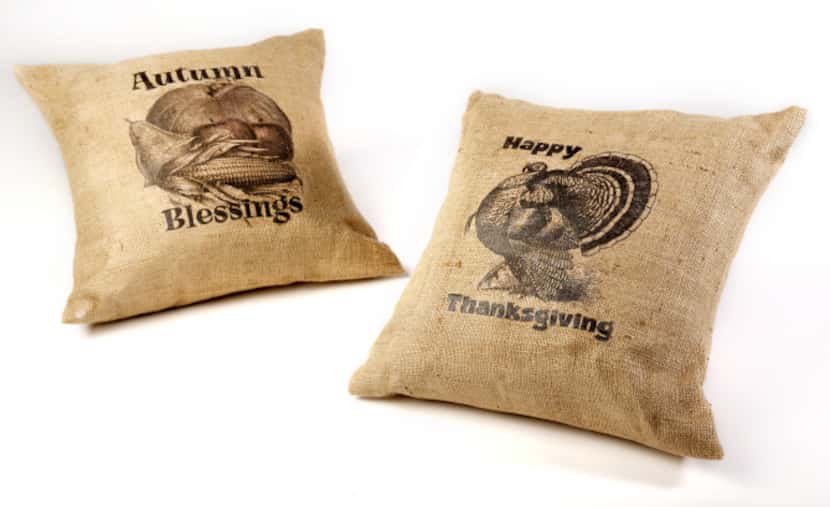 Burlap is big: Accent pillows of fabric-grade burlap are sewn and stenciled by Aislinn...