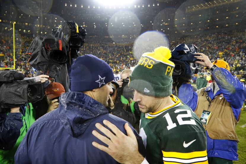 Dallas Cowboys quarterback Tony Romo (left) and Green Bay Packers quarterback Aaron Rodgers...