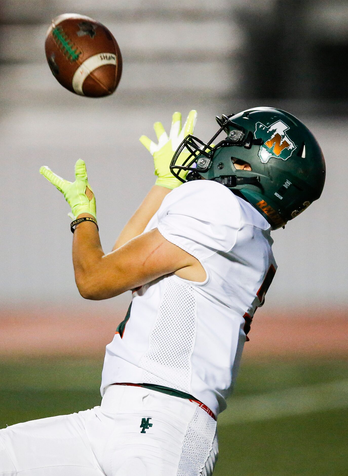 Garland Naaman Forest senior wide receiver Mike Deluna catches a pass for a touchdown during...